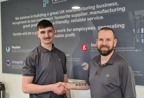 joseph weatherstone being congratulated on successfully completing his Level 2 Mechanical engineering apprenticeship